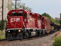 A very fresh looking CP 5989, (a recently overhauled SD40-2) and GP20ECO 2241 are on the move again after dumping welded rail at Erindale. At Mississauga Road just a head the work crew on the train will head to their parked high rail trucks, while the CWR train will continue its journey to the Hamilton subdivision.