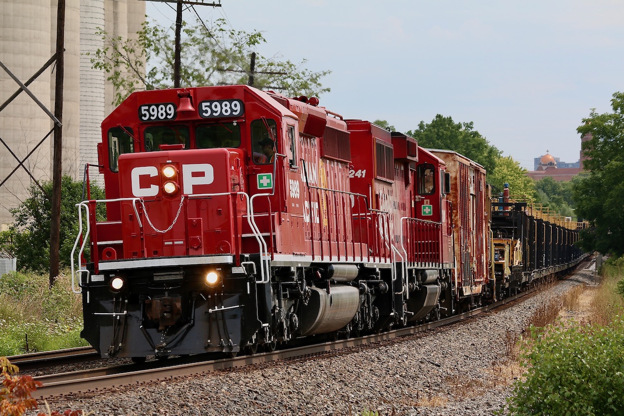 A very fresh looking CP 5989, (a recently overhauled SD40-2) and GP20ECO 2241 are on the move again after dumping welded rail at Erindale. At Mississauga Road just a head the work crew on the train will head to their parked high rail trucks, while the CWR train will continue its journey to the Hamilton subdivision.