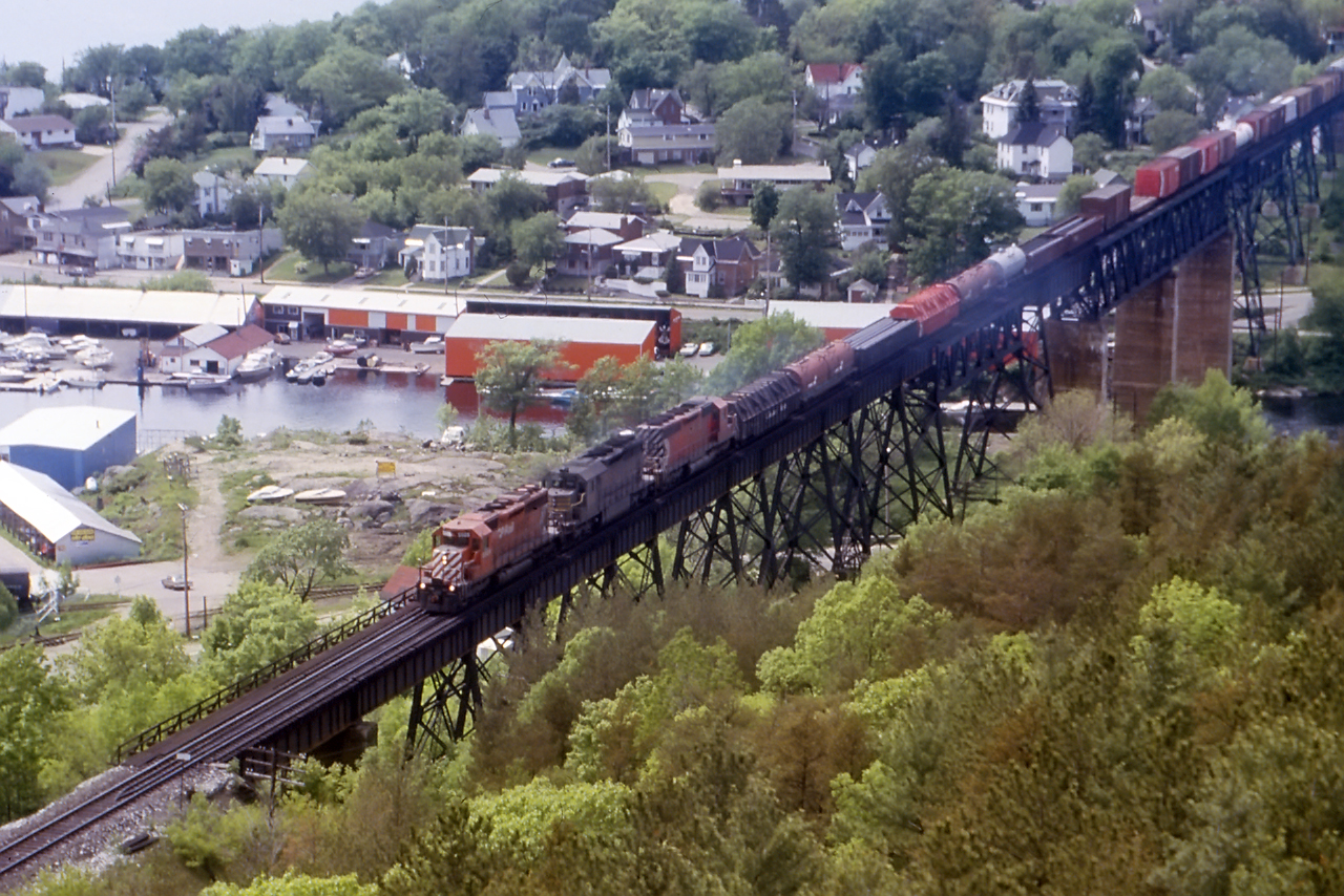 Yesterday reminded me of this...the "good old days" (says the old man yelling at clouds) before directional running. 3 CP SD40's...the middle one recently acquired from QNS&L lead a classic mixe freight...even a few 40 foot boxcars back there, across the Seguin River Trestle in Parry Sound.
