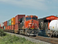CN 3064 on a westbound intermodal passes CN 3051 mid train on it's opposing traffic