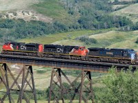 CN 8855, 8012 and BCOL 4646 head westbound onto the Battle River Trestle