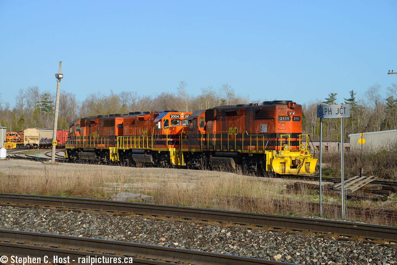 With a BNSF in ATSF paint reported on 135 the day before I had a hunch there is a chance it may lead 134 in the morning. So I beelined to Guelph Junction in the morning crossing my fingers, but it had some CP power tacked to the front. But after it passed I caught this power move on GEXR as 2111 was lifted in order to take it to the CN interchange, where it was sent to Goderich for repair. You can see at far left 3800/800 which is also out of service, making for a brief but busy motive power situation at Guelph Junction. I love days when something good happens that you least expected, and I was pleased that the power fit perfectly between that pole and the Guelph Jct sign :) This was a rare Saturday extra also.
