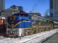 With a pair of Delaware & Hudson ALCO PA-4s upfront, Amtrak's <i>Adirondack</i> prepares to depart Windsor Station in Montreal for New York as train 68 at 0930h.<br><br>The D&H had operated passenger service into Montreal since 1923 with both its <i>Laurentian</i> by day and <i>Montreal Limited</i> overnight.  These operated into Canada over D&H subsidiary, <a href=http://www.railpictures.ca/?attachment_id=26582>Napierville Junction Railway,</a> running 27 miles from Rouses Point, New York - Delson and into Montreal via CPR trackage rights.  Endangered by declining ridership by the 1960s, new management in the D&H's passenger department sought to revitalize the operation after negative public response to the potential cancellation.  To do so, the D&H acquired four ALCO PA-1 locomotives in 1967, <a href=https://www.railpictures.net/photo/484399/>numbered 16 - 19, from the ATSF.</a>  Wearing a modified ATSF Warbonnet scheme, with D&H blue replacing the red, they would handle the trains of second hand equipment until their final runs on May 1, 1971, as neither <i>The Laurentian</i> or <i>Montreal Limited</i> were included in Amtrak's start up.  In 1974, passenger service over the D&H was to be resurrected by Amtrak as <i>The Adirondack,</i> funded by the New York Department of Transportation.  With limited equipment available to Amtrak at the time, the D&H, then led by Carl Sterzing, provided its PAs and passenger equipment for the runs.  For their return to passenger operation the PAs would be rebuilt from their original ALCO 244 prime mover to ALCO 251s in 1974 by Morrison-Knudsen, and designated ALCO PA-4s.  The rebuilt units served until 1977 when Amtrak replaced the D&H equipment with <a href=http://www.railpictures.ca/?attachment_id=45337>Rohr Turboliners.</a>  It is also noted, the D&H had acquired a fifth PA for parts in the 1960s, <a href=https://www.railpictures.net/viewphoto.php?id=481754>former New Haven 0783.</a>  It was scraped in 1972.<br><br>The four PA-4s made their way to Mexico in 1978.  All four remain, with two having returned to the states:<br><a href=https://images.squarespace-cdn.com/content/v1/5ef5133fe97a1d249ac3fe6b/1595435253815-8M4J0GTR8UFKJTW66DJY/current.jpg?format=750w>Former D&H 16 under restoration</a> at the Museum of the American Railroad, Frisco, Texas.<br><a href=https://www.flickr.com/photos/ppcharly/6795739191>Lead unit D&H 17</a> preserved at the National Museum of Mexican Railroads.<br><a href=https://www.railpictures.net/photo/754516/>railing unit D&H 18</a> under restoration by Doyle McCormack as NKP 190 in Portland, Oregon.<br><a href=https://cs.trains.com/cfs-file.ashx/__key/communityserver-blogs-components-weblogfiles/00-00-00-07-48/8130.DSC_5F00_3313.jpg>Forer D&H 19</a>preserved at the National Museum of Mexican Railroads.<br><br>This scene from the platform at CP's Windsor station includes RDCs at left with differing letter boards, one action red, the other maroon; the former CP Chateau Champlain Hotel, opened for Expo67, and now operated under Marriott.  The CN Rail headquarters building looms over the scene, and The Queen Elizabeth hotel, originally built by the CNR, and now operated by Fairmont.<br><br>More D&H PA Canadian action:<br><a href=http://www.railpictures.ca/?attachment_id=10875>D&H 16 near Montreal West</a> by Neil Compton<br><a href=http://www.railpictures.ca/?attachment_id=10874>D&H 18 at Montreal West</a> by Neil Compton<br><a href=http://www.railpictures.ca/?attachment_id=12195>D&H 18 at Westmount</a> by Steve Danko<br><br><i>Original Photographer Unknown, Jacob Patterson Collection Slide.</i>