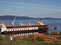 On the east coast of Vancouver Island at the BC Forest Products mills at Crofton, the primary railway connection to the mainland was provided by rail ferries, here showing as SEASPAN DORIS (formerly DORIS YORKE of F. M. YORKE and Sons) and about to be switched by Whitcomb number 9 of Stuart Channel Transportation shown lurking at the lower right on Friday 1975-05-09.

<p>CP’s E&N had a direct connection to Crofton, known to CP as Crofthill, from a junction at Osborn Bay, but in later years it was used only when various marine difficulties made the rail ferry option unavailable.