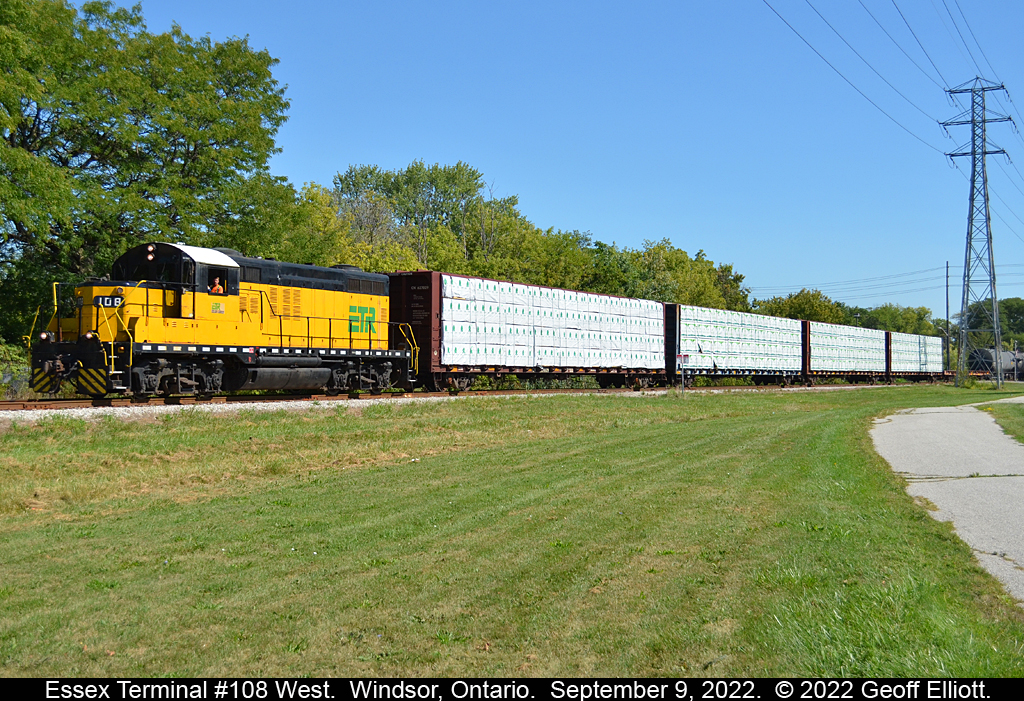 Essex Terminal GP9 #108, Ex-Cartier #59, leads the 0830 job west having just crossed Brock Street.  #108 is headed toward Ojibway Yard with a long cut of cars including 4 centerbeam flats of lumber on the head-end for unloading at Morterm.  #108 will meet up with #107 at Ojibway today and finish out the day there prior to heading back to the shops.