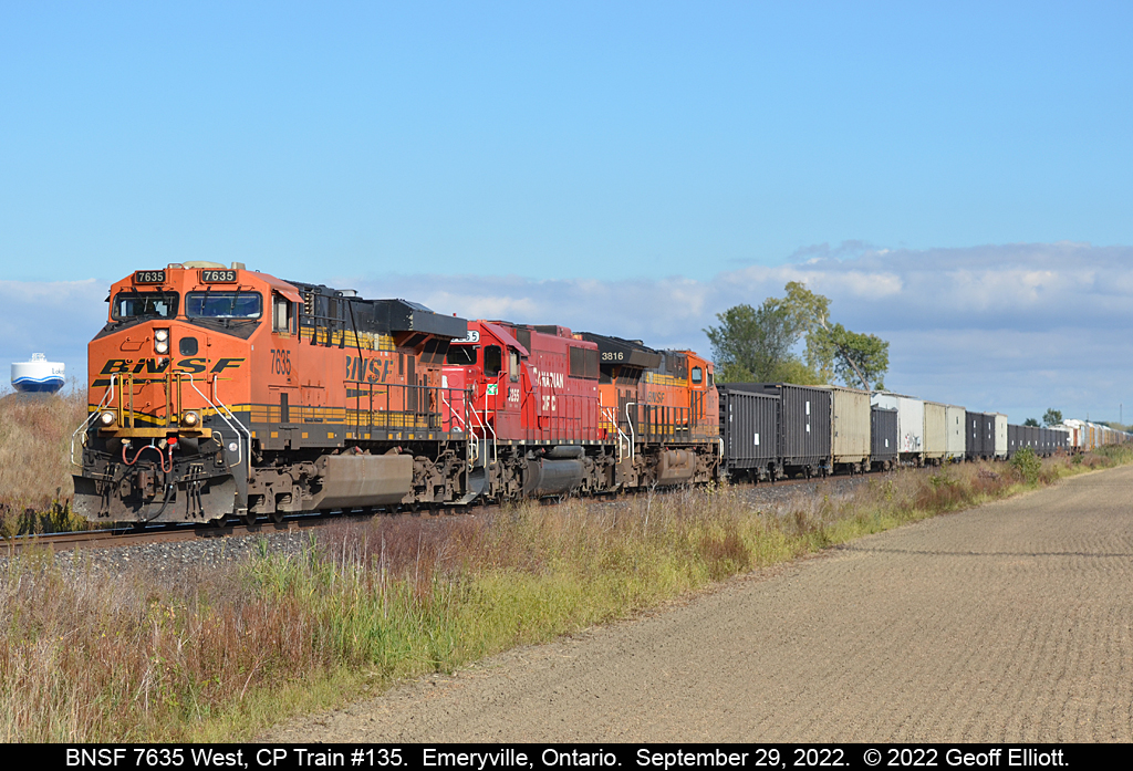 A colorful CP Train #135 was on tap today.  Into London with CP SD60 #6255 on point, they added BNSF ES44DC #7635 to the point to continue the trip west to Windsor.  With the 'Lakeshore' water tower in the background BNSF #7635 high-balls through Emeryville, Ontario with a large string of AIMX (American Iron and Metal) scrap gons behind the power in the last few minutes of it's trip over the Windsor Subdivisio