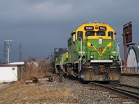 A heritage yard set is in the middle of switching out Imperial Oil along Metrolinx's Newmarket Subdivision, the sunlight from a brief sucker hole illuminates how much grime has accumulated on the GP40-3 during it's first year and a half at Mac Yard in yard and industrial switching.