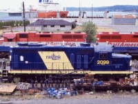 I have always had an interest is Canada’s island railroads. Sadly the years have not been kind to them and most have lost their rails. Thankfully my 2003 trip allowed a short period of time to visit Vancouver Island. At that time RailAmerica was still operating the former CP lines on the island. The two GP38’s seen here at the time were the main power, with Railink GP20 kept as back up. While marked as a GP20, the 2099 is internally a GP9 and the split exhaust stacks illustrate this. The unit was built for the CB&Q as a GP20 but rebuilt years later. I have crossed paths with the unit years earlier as it was assigned to the RLK/SOR out of Brantford but numbered back then as 1751. 