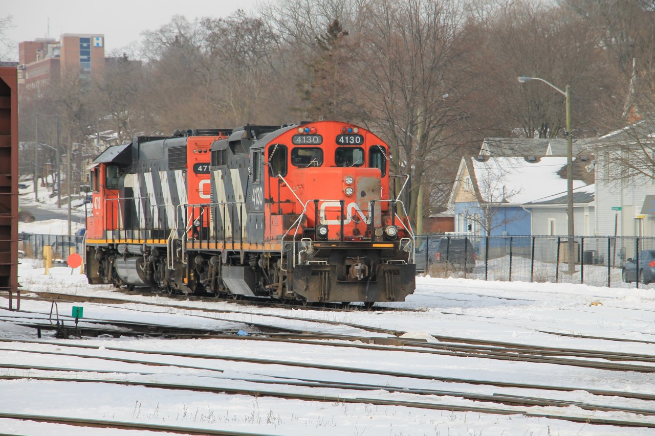 CN 4130 and CN 4713 tied down in Brantford Yard waiting their next assignment.