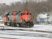 CN 4130 and CN 4713 tied down in Brantford Yard waiting their next assignment.