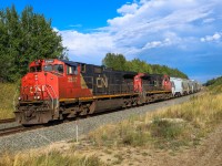 Taylor, Wisconsin to Fort St. John, BC sand train S 77181 02 highballs through Stony Plain with a pair of Canadian Cab GEs; CN 2507, CN 2514 and 89 frac sand loads.