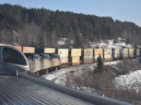 A beautiful day and location for a mid-morning meet between VIA #2 The Canadian, and a hot-shot CN double stack. Jones is a cottage dotted, heavily forested, part of northwestern Ontario on East Lake between Farlane  http://www.railpictures.ca/?attachment_id=49924  and Favel. The dwarf signal at mile 105.8 would be green in less than a minute after this photo signaling our permission to leave the siding and continue eastbound after a perfect meet.