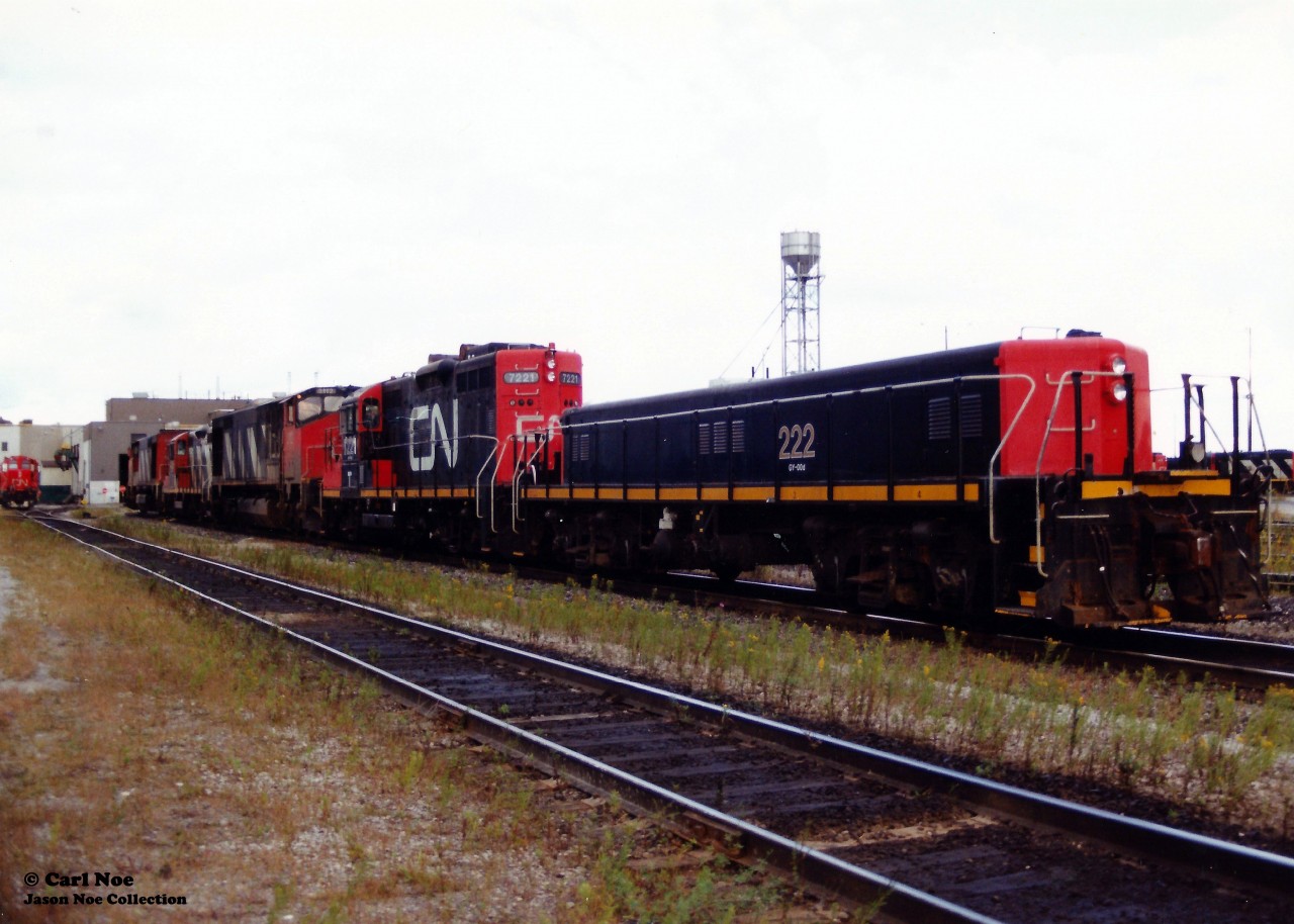 CN GP9 Slug 222, GP9RM 7221 and HR616’s 2109 and 2112 with GP9RM 4138 in the middle of the pair are viewed at CN’s MacMillan Yard during a cloudy September afternoon.