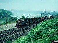CN 3229 leads a train off the Grimsby Subdivision approaching Bayview Junction during a very hazy summer day.