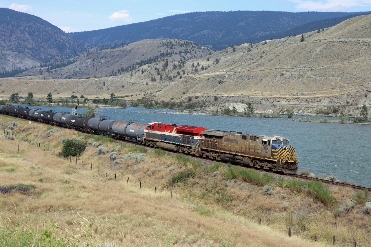 This westbound certainly generated a frantic stop. We were driving east from Spences Bridge towards "the fruit stand" when this westbound came around the bend with CN 3913 (a former CREX unit) and BC Rail heritage unit 3115! All's well that ends well--we got set up in time with this result.