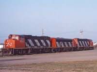CN 5580, 9105, and 5568 at rest in Brandon in 1984. The 9105 was built as the 9056, and was the second last F7Au remanufactured in 1974. Twenty years later she was converted to this "B unit" configuration, remaining in service until 1989. The GP38-2Ws would be renumbered to the 4700-series in 1988 to free up the 5500s for new SD60Fs.