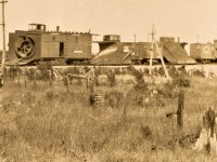 Canadian Northern early rotary snowplow 61303 enjoys the summer along with other snow equipment. Location and date are a total guess, but Capreol, Ontario is a reasonable guess based on location of water tank (cropped out of image) and yard tracks. The 61303 was scheduled to be renumbered CN 55070 in the 1920 master renumbering plan and may or may not have actually been renumbered. Apparently, there was also a 61301 of similar design. Any additional information would be appreciated.