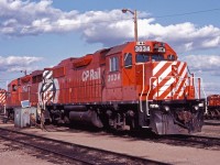 Year-old GP38-2 3034 and 20-year old GP35 5006 idle on the shop track in Brandon with S4 7116 and GP9 8535 (both veterans with about 30 years of service). The 3034 was one of 20 delivered in 1983 with another 95 to be delivered over the next two years for secondary and grain service. CP's GP35s and the two GP30s were also used around Manitoba in that service in the early-mid 1980s.