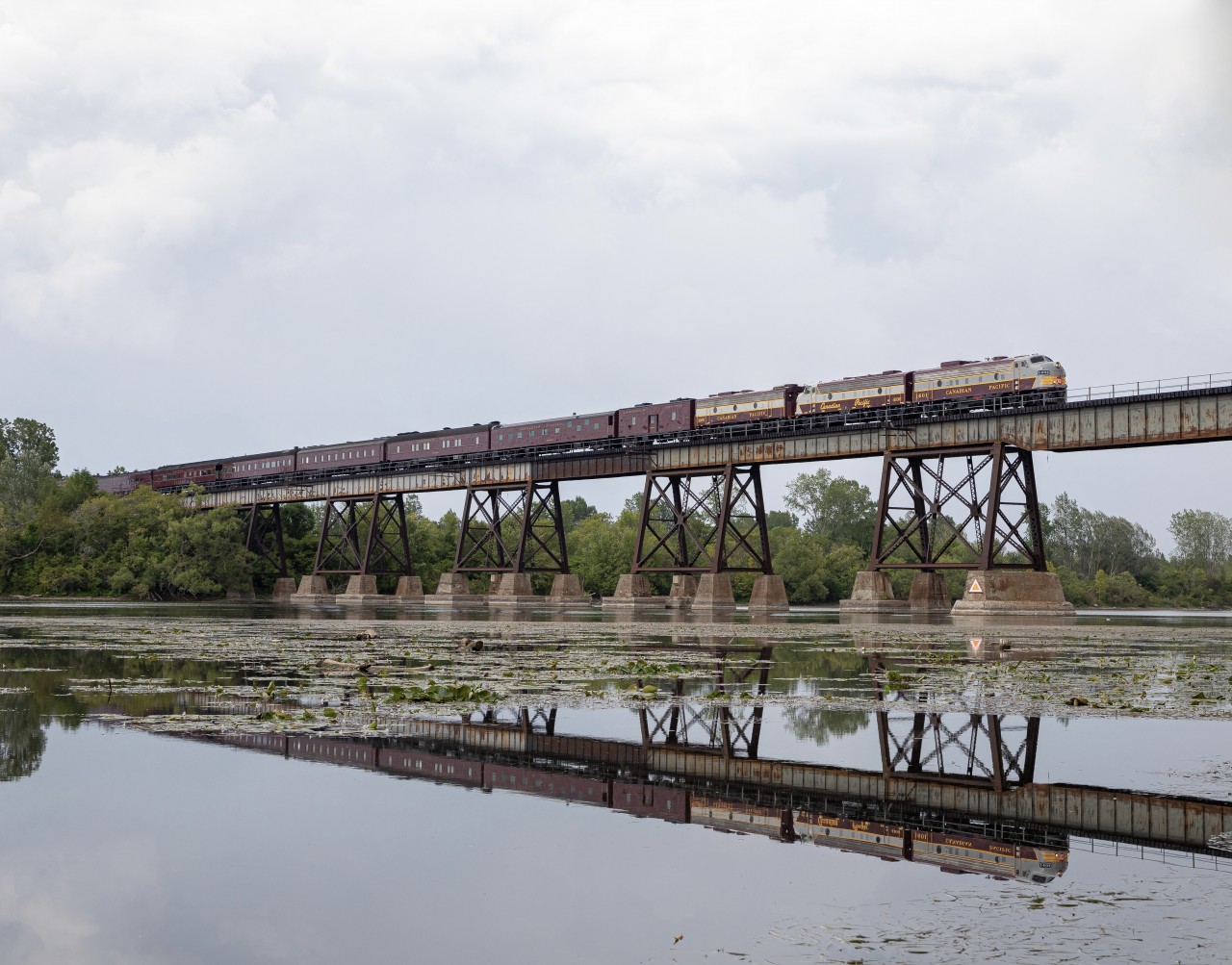CP 41B crosses over the Trent River heading back out west, after spending a week and a half in Ottawa, for the CP Womens Golf League. Leading these beautiful Royal Cars are a pair of beautiful F units, and a B unit creating power for the F units to haul their train back west.