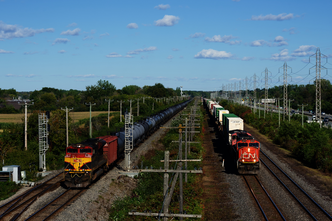 KCSM 4064 brings up the rear of ethanol train CP 528 as CN 123 with CN 5679 & CN 2505 heads west through Sainte-Anne-de-Bellevue.