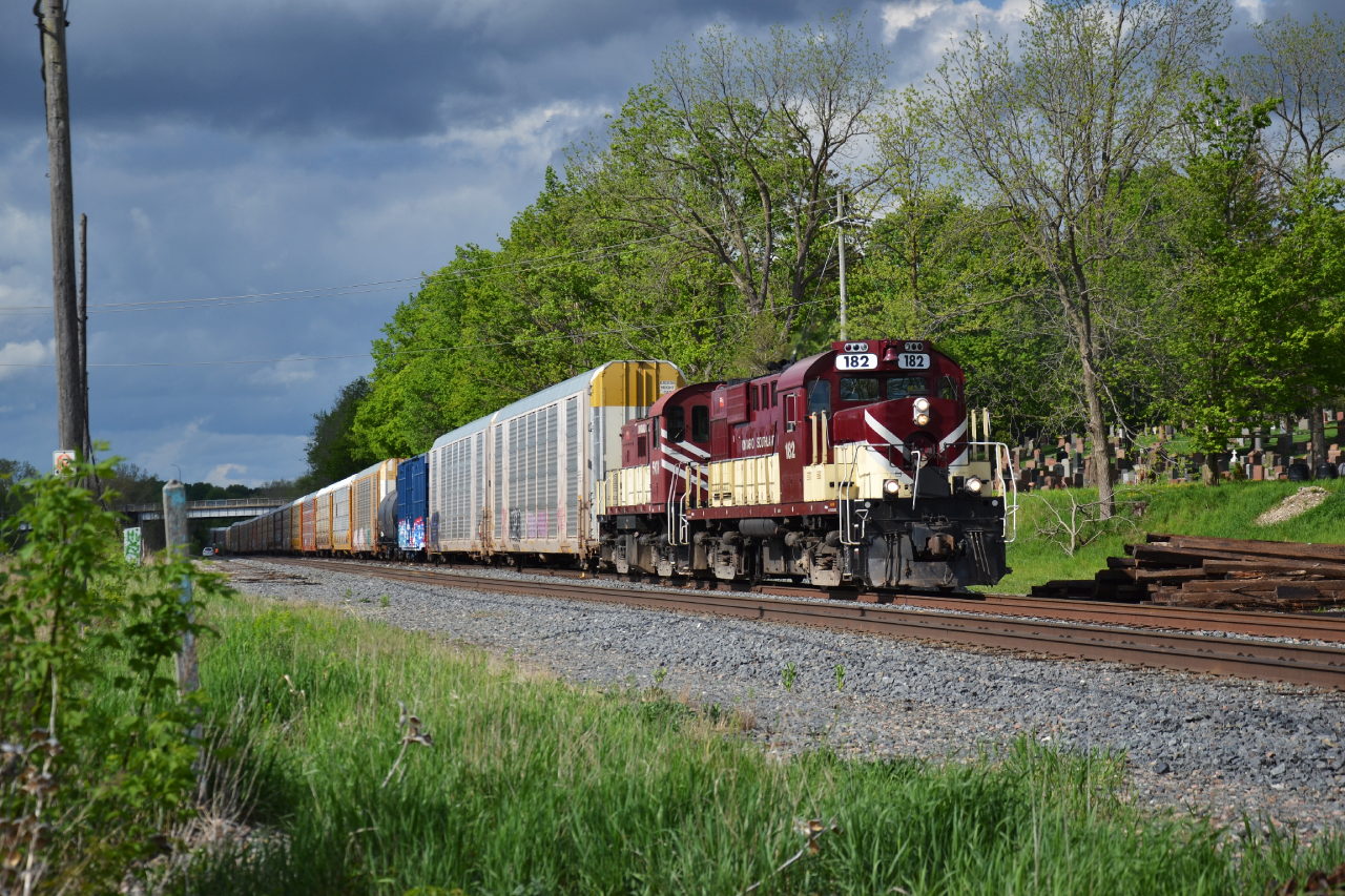 Talk about sucker hole and storm lighting. OSR 182 leads the Woodstock job ahead with a rather impressive train in tow for Ingersoll. I am curious what the future will be for the GM plant in Ingersoll, with the eventual transition to van tooling and production. Autoracks will no longer be able to transport them. Anyone have any idea what can replace the autoracks? Auto boxcars are a thing of the past. Only thing I can imagine are flats but I doubt GM will go for it.