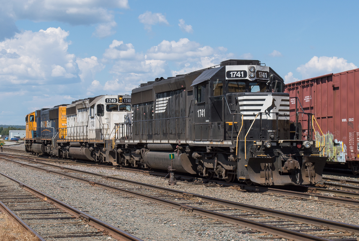 The power for ONR Train 211 sits in the yard at Englehart.  ONT 2103 would be the leader North with the ex KCS (ONT 1740) and ex NS (ONT 1741) trailing.  The ONR has been snapping up a lot of second hand EMD power lately, these two units were pressed in to service quickly with minimal patching.