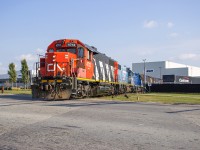 CN L568 lifts traffic out of HCL Logistics on the Oxford Spur.  Having worked Stratford Yard and Agromart on their westward trip, they will have a straight shot home to Kitchener after spotting inbound cars.