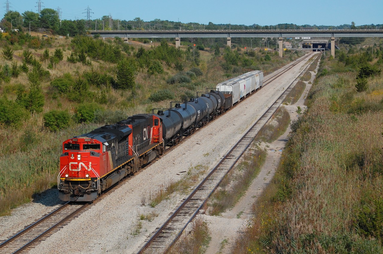 View of CN 562 with CN SD70M-2 8822 and CN SD70I 5608 seen at Mile 17 of the CP Hamilton Sub for Feeder for Interchange traffic with GIO Railways.