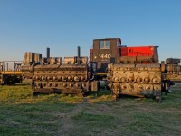 It looks like things have not gone well for CN 1440 since being sold to SSR.  As the sun sets on this September evening, it's remains sit partially obscured by a pair of 645s. 