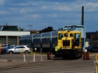 One of National Steel Car's two 50-tonners is pulling six new CP grain cars out of a building as they get ready to back the cars into another section of the plant. This unit was built in 1954 and has spent its entire career here.