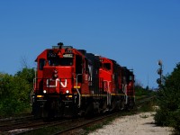 CN's 7500-series GP38-2s (originally in the CN 5536-5559 group) had been converted to serve as hump mother units to work with slug units in the CN 500-526 series. However a number of them have been released into the general pool and here CN 7512 leads CN 9449 and CN 4719 as they cross over from the South Track to the North Track of the Halton Sub.