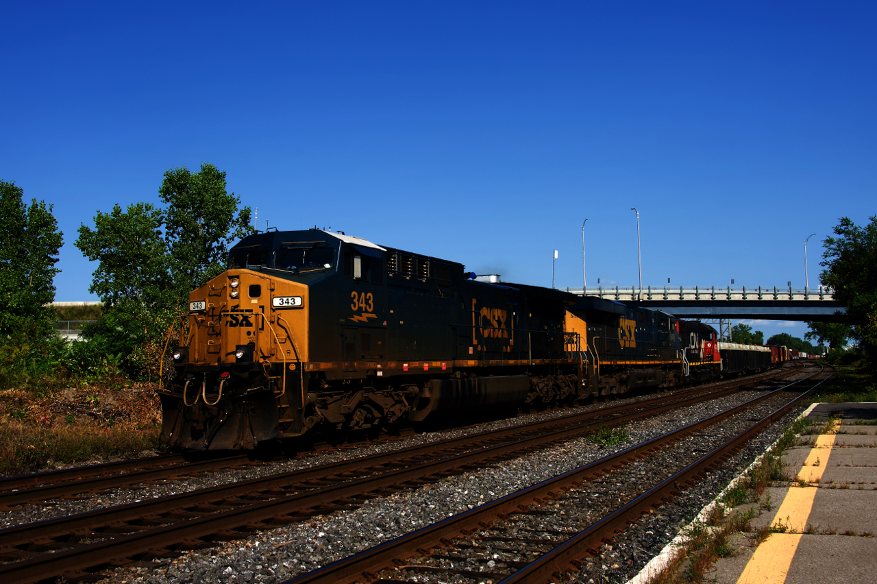 CN 327 is passing through Dorval with CSXT 343, CSXT 5479, CN 4700 and 113 cars.