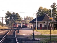  I was worried that the sun was going to set before CN trains #450 and 451 showed at Gravenhurst, as the day comes to a close early in September. And too bad the "meet" was a bit down the line, but better than no meet at all.
I missed #450 as I heard it from the other side of town, but fortunately #451 northbound showed up.  CN 9426, 9619, 9694, 9447, 9603 and 4521 made my run over to the station worthwhile. Beautiful evening to be shooting the breeze on the back of the caboose heading south. Such a shame trains are now cabooseless.
CN 451 and 450 ran between Toronto and North Bay (ONR) and I understand they still do, although no longer daily.