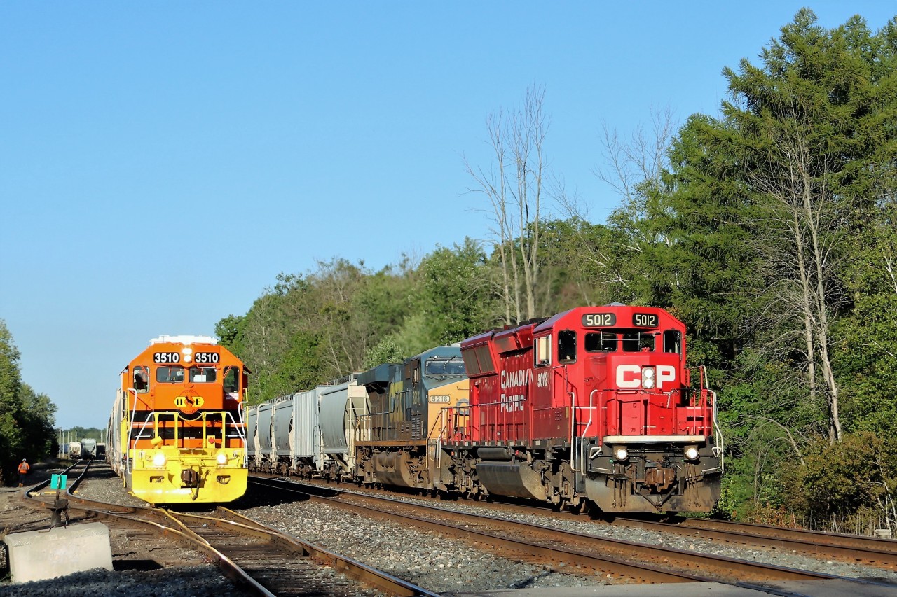I originally went to Guelph Junction in hopes of getting 2T69 and H88 in a side by side but alas, it never happened.  Around the bend comes Huron and Eastern 3510 (GEXR job) rolling towards me. All I could think about at the time is for it not to make me miss the original train I went for. It rolled on by and slowly backed to this location to hook up two more cars for H88. I could see 2T69 coming and hoped the shadows wouldn't get in the way and the GEXR job be far enough back.  CP 5012 with CSX 5218 roll by on their westward trip up the Galt sub. I did manage the side by side but I think this one is even better.