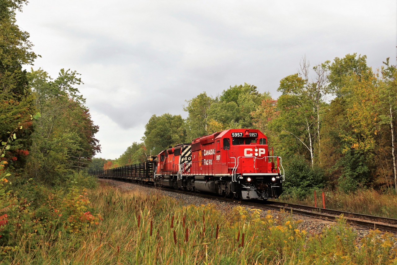 The CWR train rumbles through the light rain with a touch of sun poking out as it rumbles south down the Hamilton sub passing the Wildhagen greenhouse on the Milburough town line with a very nice CP 5957 leading CP 6055. The SD40-2's are always a welcome sight especially when our friends at CP clean them up.