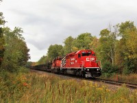 The CWR train rumbles through the light rain with a touch of sun poking out as it rumbles south down the Hamilton sub passing the Wildhagen greenhouse on the Milburough town line with a very nice CP 5957 leading CP 6055. The SD40-2's are always a welcome sight especially when our friends at CP clean them up.