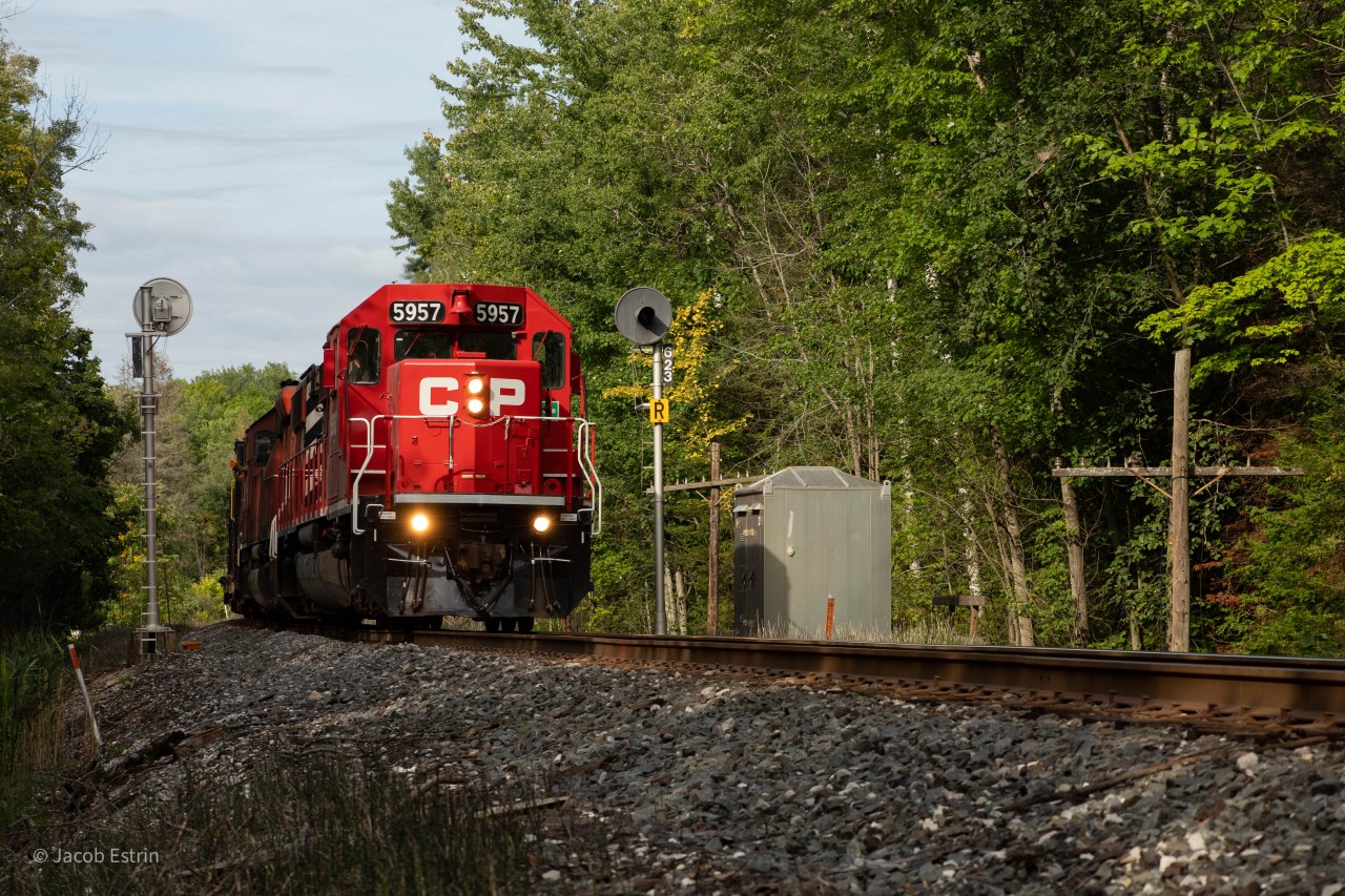 CP 5957 South passing by the approach signals at Mile 62.3 on the Mactier Sub.