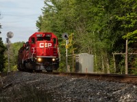 CP 5957 South passing by the approach signals at Mile 62.3 on the Mactier Sub.
