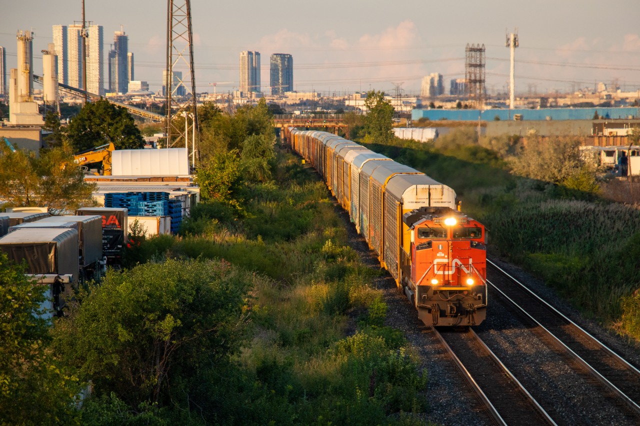 Here comes the Thunder...
As the sun rapidly sets over the GTA, CN 271 charges out of the Humber Valley with CN SD70M-2 "Thundercab" number 8000 taking charge. Many people forget that the CN Halton sub actually does cross the city of Toronto in the northwest corner. Nearly the entire trackage through the city is visible in this shot (Hwy 427 to Martin Grove & Steeles).