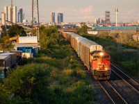 Here comes the Thunder...
As the sun rapidly sets over the GTA, CN 271 charges out of the Humber Valley with CN SD70M-2 "Thundercab" number 8000 taking charge. Many people forget that the CN Halton sub actually does cross the city of Toronto in the northwest corner. Nearly the entire trackage through the city is visible in this shot (Hwy 427 to Martin Grove & Steeles). 