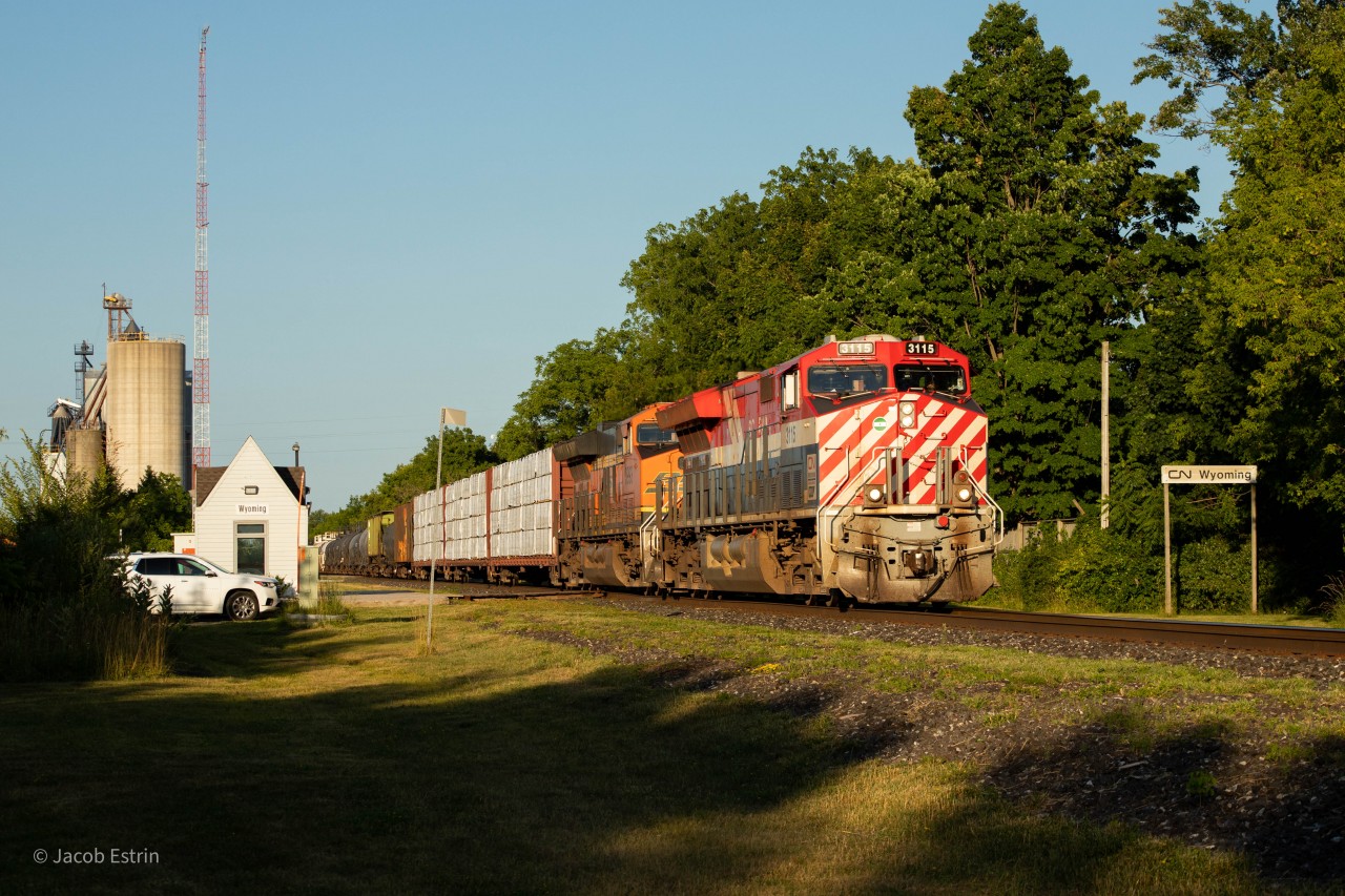 CN 3115 in the lead of M397 as it passes through Wyoming's tiny VIA Station.