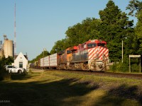 CN 3115 in the lead of M397 as it passes through Wyoming's tiny VIA Station.