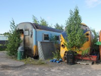 Like an abandoned railway line, nature is slowly reclaiming this former Ontario Northland TEE-Train equipment as it sits stored in a North Bay Road Works compound. Paul O'Shell captured a similar view in 2015 http://www.railpictures.ca/?attachment_id=20706