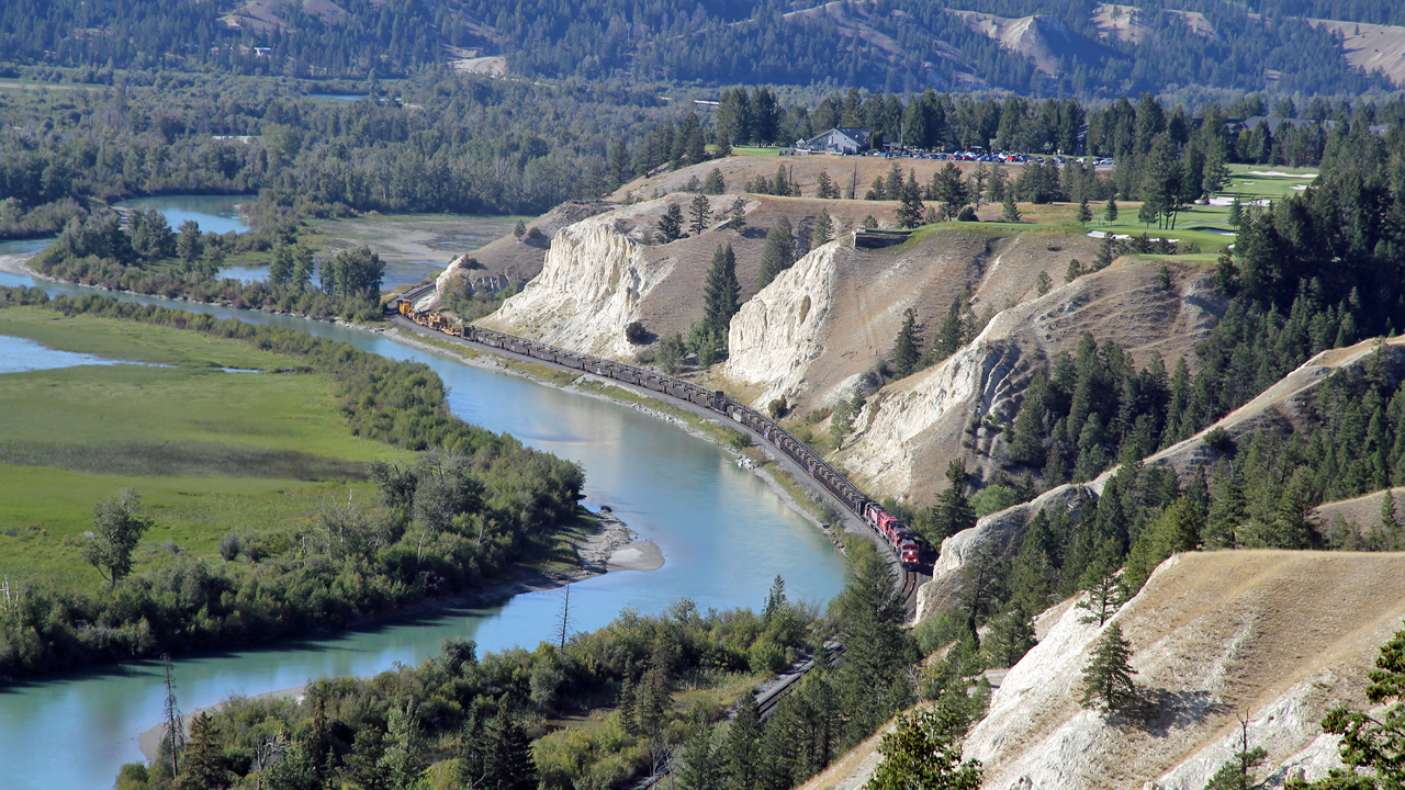 A CP work train makes it's way south on the Windermere Sub skirting the sandstone cliffs beneath the Radium golf club.  4 locos on the head end, CP 8048, CP 8109, CP 6012, CP 5936.
