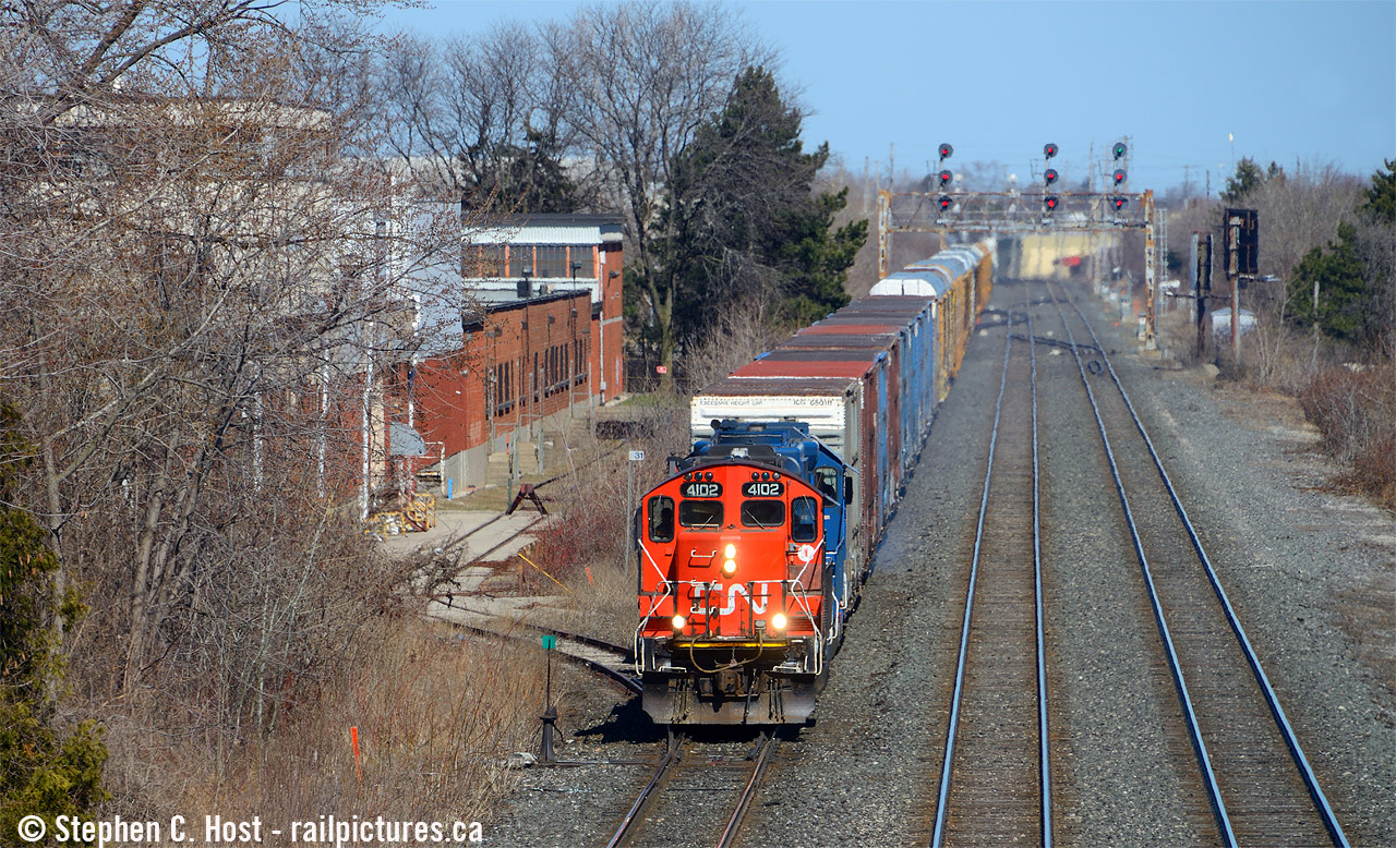 At the Drury Lane bridge, CN L554 is heading west with CN 4102 in the lead. This unit was sold to Lambton Diesel Specialists and is being painted right now in LDS's black paint scheme.