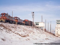 Following up on Dan's recent posting and extensive research of <a href=http://www.railpictures.ca/?attachment_id=49783>CP SW9s working in hump service at Agincourt,</a> here we see a pair, CP 7403 and 7404, cresting the hump as the last few cars are set free.  After their rebuild in 1982, CPR 7403 emerged as CP 1202, while CPR 7403 emerged as 1200.  1202 would be retired in 1999 and sold to HELM, and later to Larry's Truck and Electric in 2003.  In 2005 1202 found a home in the western United States as <a href=http://www.oregonpacificrr.com/images/OPR1202x031.jpg>Oregon Pacific 1202.</a>  CP 1200 would be retired and sold to HELM in 1998, disposition unknown.<br><br><i>Original Photographer Unknown, Jacob Patterson Collection Slide.</i>