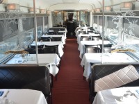 A recent photo I posted of the dining area in a VIA Skyline car on my journey from Winnipeg to Churchill solicited some comments about the amenities and level of service offered  http://www.railpictures.ca/?attachment_id=49772
Here we see a dining car interior experienced on VIA #1 The Canadian back in December of 2021. Quite a different level of 'comfort and service' from the Churchill run. Leather covered dining chairs, linen table cloths & napkins, china coffee cups, heavy silverware, and a team of 3-4 attendants.
While the full kitchen/dining car experience offers a much superior level of food, service, and ambiance, the Skyline car environment on the Churchill trip was equally as enjoyable in its own right. I'm looking forward to experiencing them both again. :-)
(map location approximate. We had not yet arrived in Washago from Toronto when I snapped this photo)
