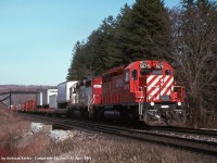 Canadian Pacific SD40-2 5679 and SOO Line SD40-2 6611 leading a westbound TOFC train approaching Canyon Road on April 10th, 1995