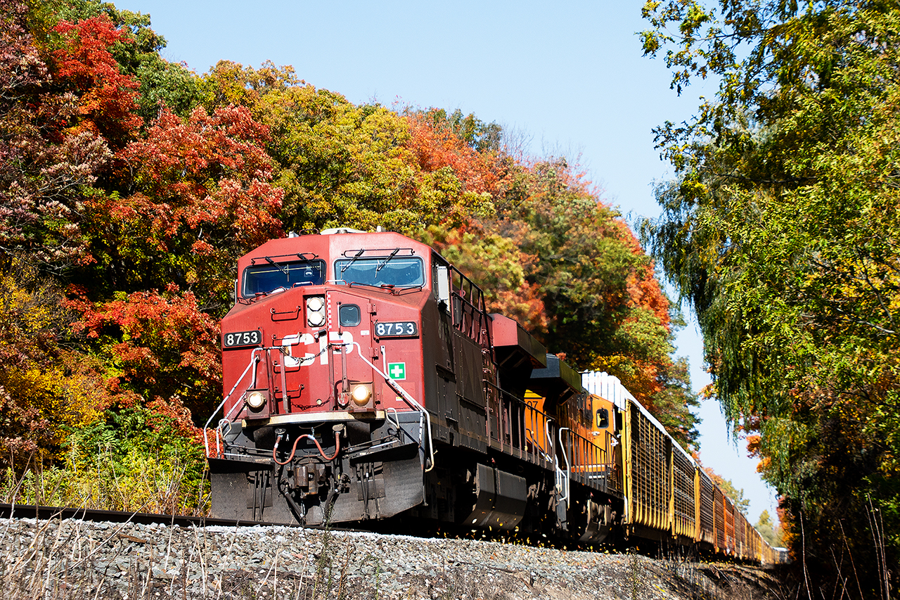 The climb up Orr's Lake Hill is the stuff of legend going back to the days of stem helpers that were based at Galt...if they didn't stay with the train all the way from Toronto. AC technology has seemingly reduced the challenge, although I have witnessed pairs of GE's down to less than 5mph trying to drag tonnage unimaginable in the old days up the hill. Today's 137 is something of a rocket, although I think the blowers were helping keep the leaves off the rails as 8753 and BNSF 7407 make great time getting up the hill.