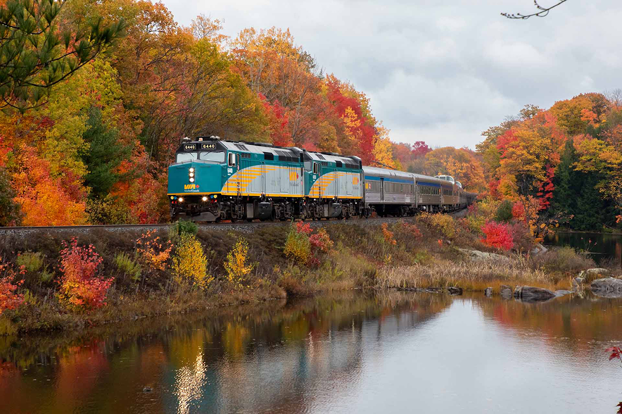 The fall colours are at their best as VIA 1 has just run around CN 107 and is right on time for its next stop in Parry Sound...on CP's tracks. 

Yes, there was an idler car on the tail end. There are no polite words to describe my opinion of that nonsense.